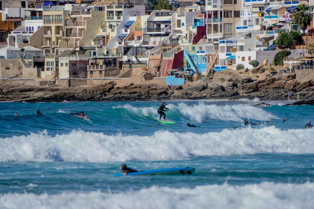 Surfing in Morocco for Beginners: A Local’s Ultimate Guide surfing in Morocco for beginners (a group of beginners surfing in taghazout Morocco)